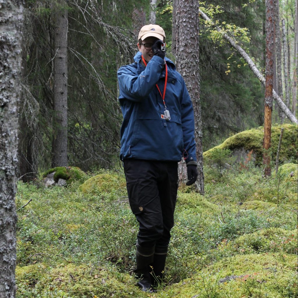 Aleksi measuring the height of a tree